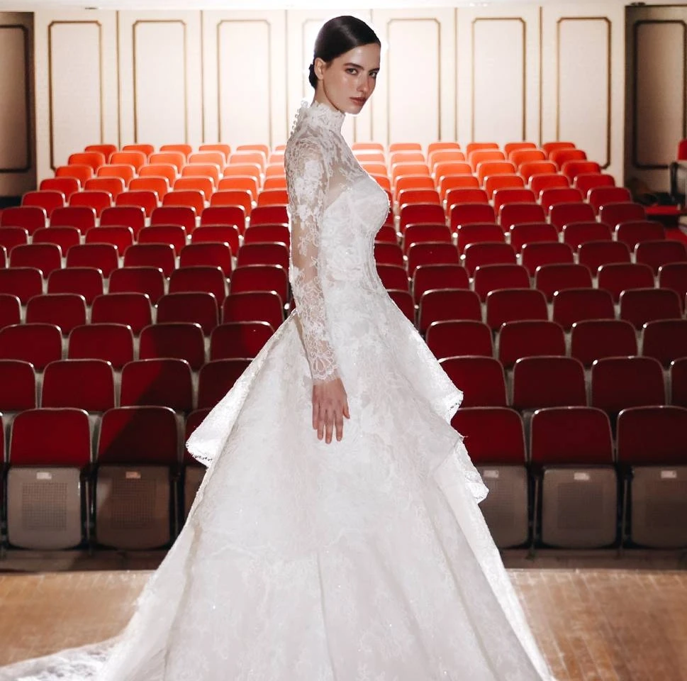 Model wearing a white gown by Choie Bridal