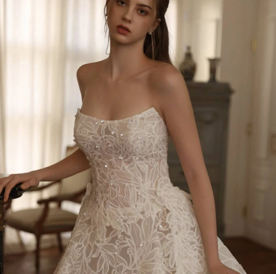 Model wearing a white gown by Choie Bridal