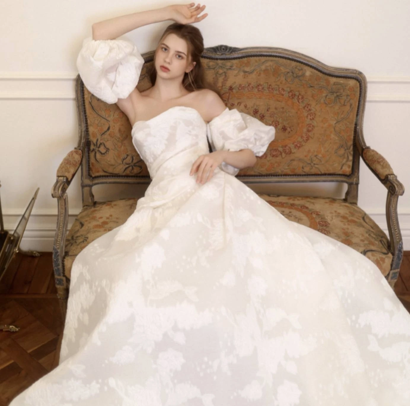 Model wearing a white gown by Choie Bridal