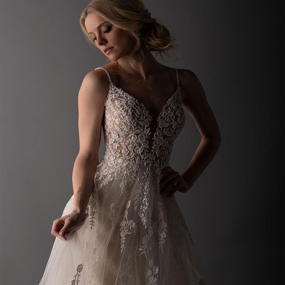 Model wearing white Martina Liana wedding dress