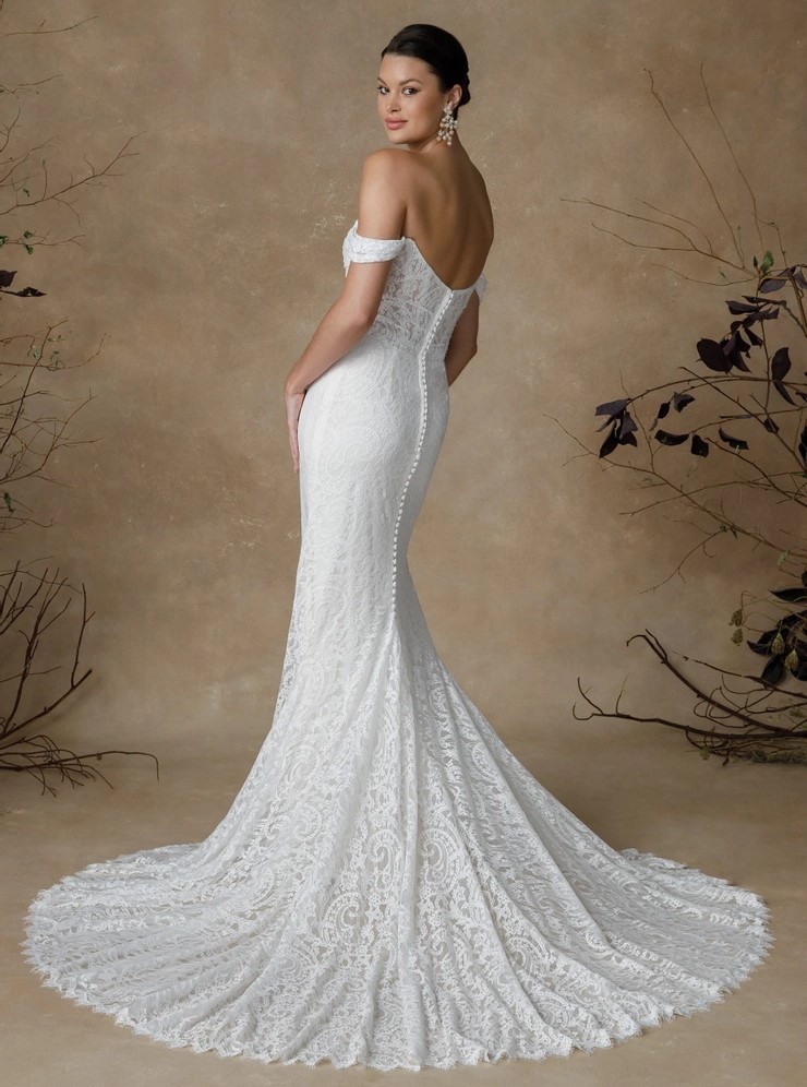 Model wearing a white gown by Justin Alexander
