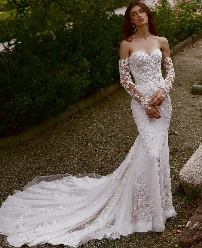 Model wearing a white gown by Justin Alexander