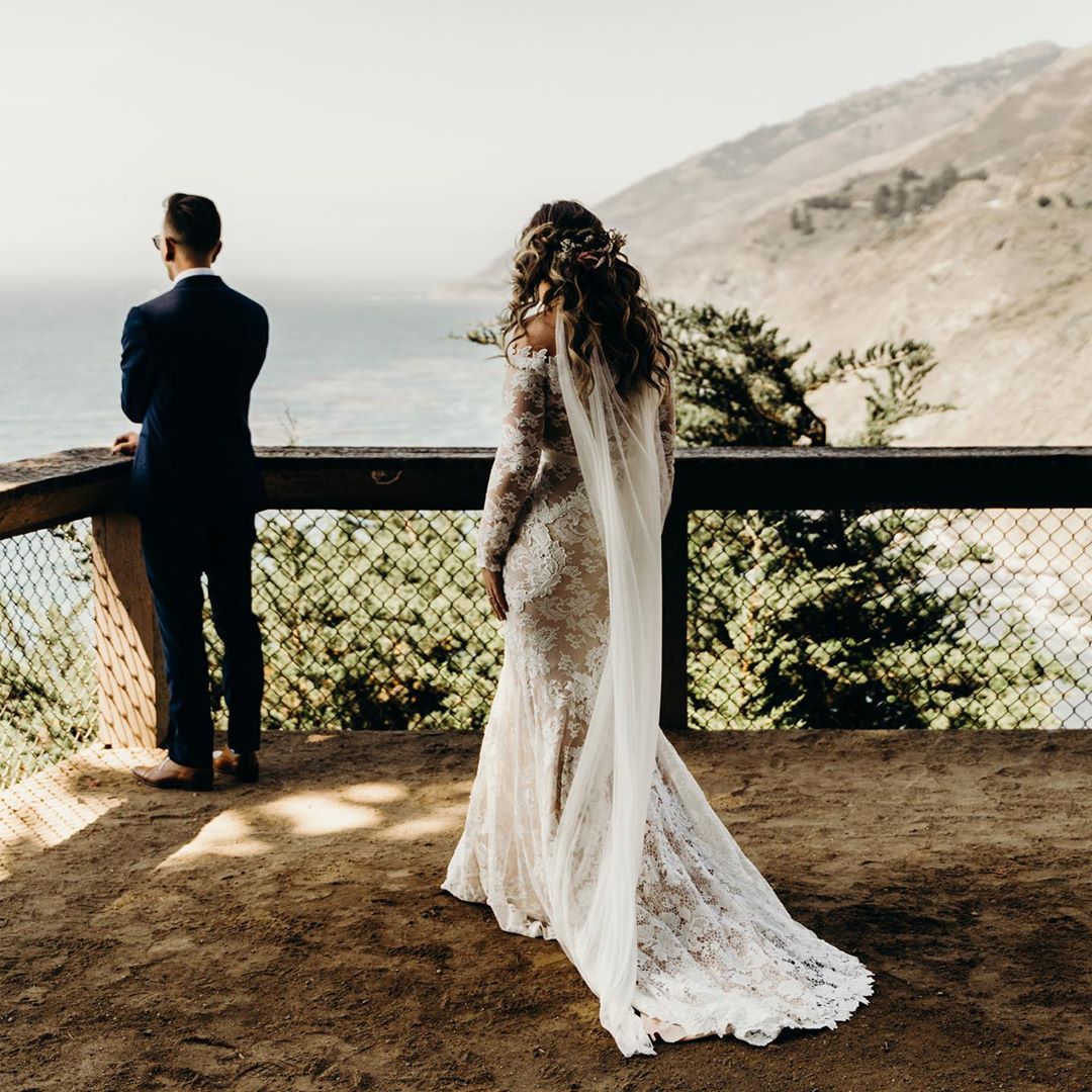 Bride Walking Up To A Groom Wearing A White Wedding Dress.